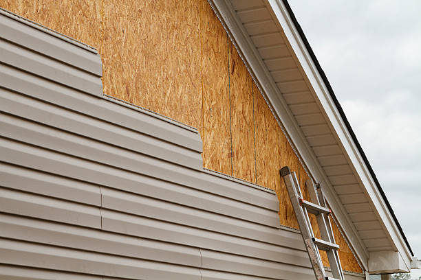 Professional Siding Repair technician working in Oakville, CT